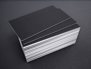 Close-up of business card on a black background. 3d rednering.