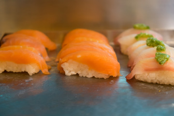 Close up of sushi on the tray.