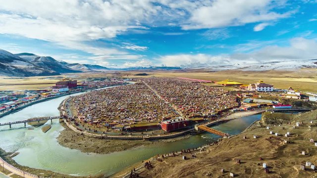 Timelapse of Landscape View of the Yarchen Gar Monastery with many shacks for monks in Garze Tibetan,Sichuan,China. There is The Giant Monasteries of Kham &the largest concentration of nuns and monks