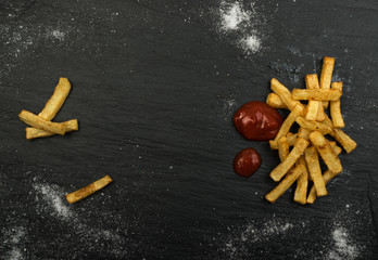 French Fries with Ketchup on Dark Background