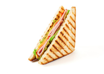 Sandwich with ham, cheese, tomatoes, lettuce, and toasted bread. Front view isolated on white background.