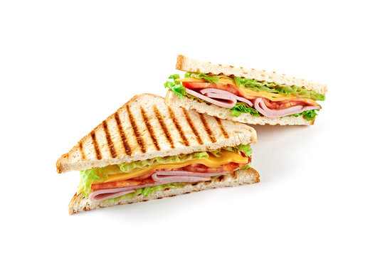 Sandwich with ham, cheese, tomatoes, lettuce, and toasted bread. Above view isolated on white background.