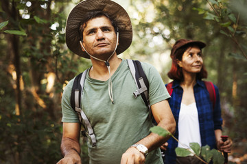 Couple trekking together in a forest