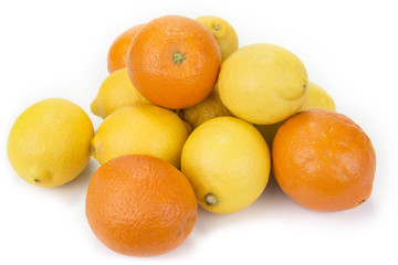 Fresh oranges and lemons on the white background