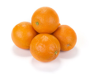Fresh juicy oranges with halves on the white background