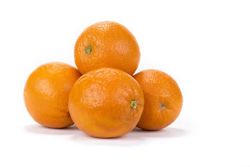 Fresh juicy oranges with halves on the white background