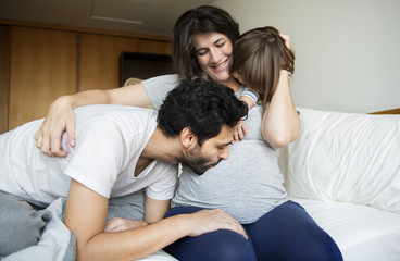 Pregnant family spending time together