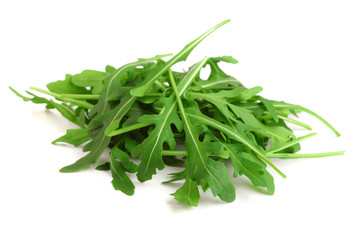 Heap of Green fresh rucola or arugula leaf isolated on white background