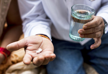 Indian people taking medicines
