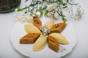 A plate with national pakhlava and shekarbura as Novruz symbol