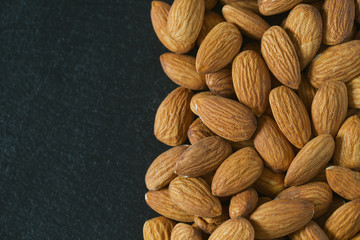almonds on black surface
