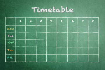 School timetable on green chalkboard background for business and education background