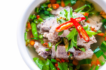 Close up Spicy Pork with Pork bone Soup on the isolated white background.