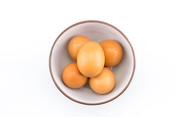 Eggs in bowl on white background