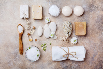 Fototapeta na wymiar Spa setting for body care and relaxation on stone background top view. Flat lay.