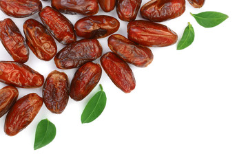 dry dates with green leaves isolated on white background with copy space for your text. Top view. Flat lay pattern