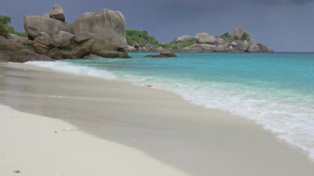 Landscape with white sand beach and storm sky on Similan islands, Thailand, 4k
