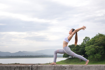 Fototapeta premium Asia woman doing yoga fitness exercise