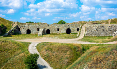 Photo of ancient stone ruins with many doors in Kamyanets-Podilsky