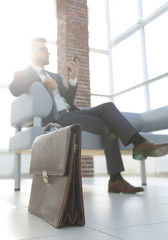 Businessman sitting on sofa in the office