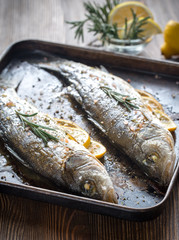 Baked sea bass with lemon and rosemary