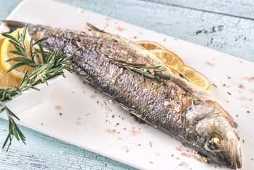 Baked sea bass with lemon and rosemary