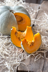 Ripe pumpkin on the wooden background