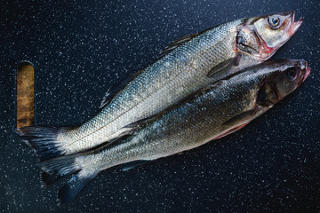 sea bass preparation on chopping board