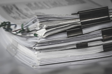   report paper stacking of office working document , retro color tone