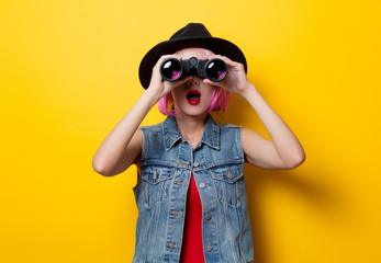 hipster girl with pink hair style with binoculars