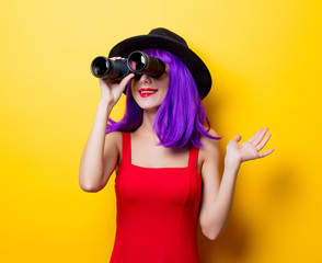 hipster girl with purple hairstyle and binoculars