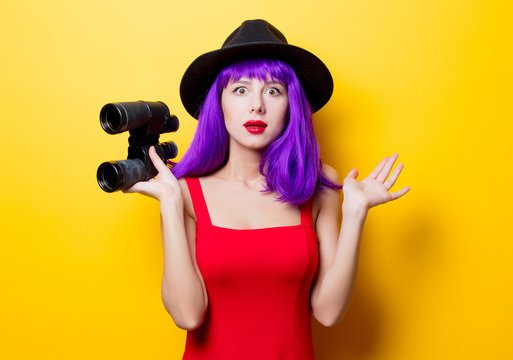 hipster girl with purple hairstyle and binoculars