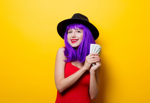 hipster girl with purple hairstyle with money