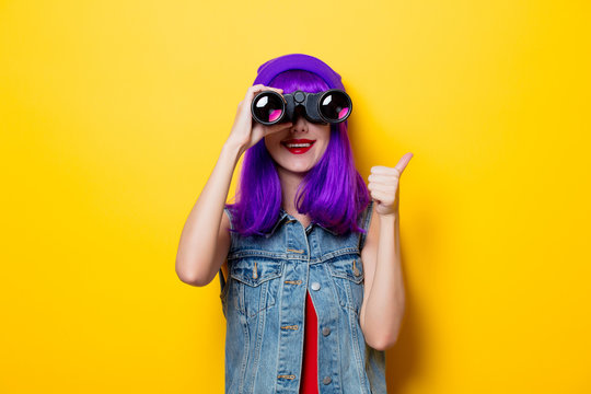 hipster girl with purple hair and binoculars