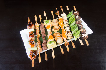 japanese cuisine. grill stick on the background