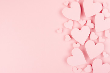 Fototapety  Paper pink hearts fly on soft pink color background, border, copy space. Valentine day concept for design.