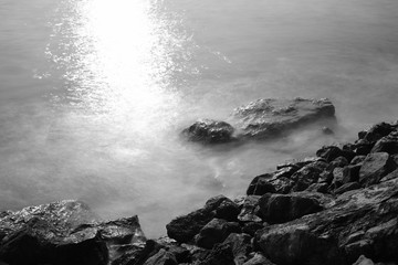 sea waves and the rocks, long exposure photography for smooth water, black and white photography
