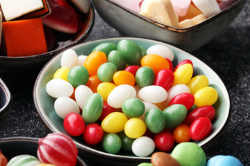 candies with jelly and sugar. colorful array of different childs sweets and treats