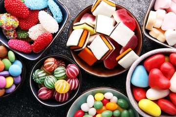 candies with jelly and sugar. colorful array of different childs sweets and treats