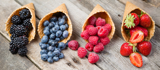 Selection of summer berries in ice cream cones