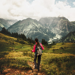 Fototapeta na wymiar Woman hiking through mountains