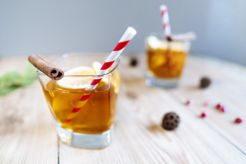 fresh drink in glasses with slices of lemon and paper straw