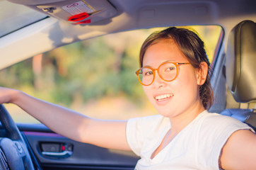 Woman smiling happily in the car.