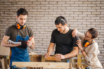 Students in woodwork training course with professional