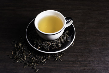 Tea on wood background.