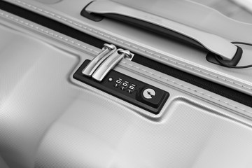 Closeup detail of a suitcase briefcase with focus on  combination lock password number 