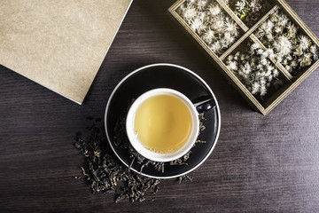 Tea on wood background.