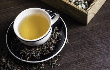 Tea on wood background.