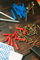 Hammer, construction and repair tools on wooden board background, top view, closeup