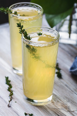 Traditional Italian beverages limoncello on a wooden table.
